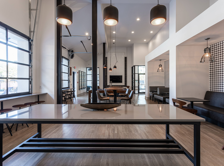 hang out in this beautiful clubhouse Table, hanging light fixers, couches.